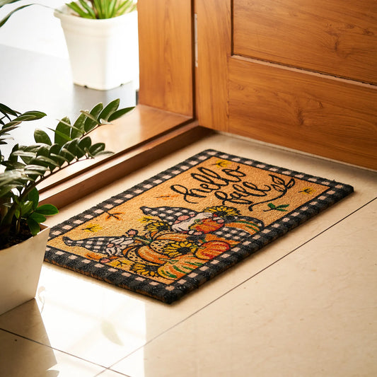 Decorative doormat with autumn design and 'Hello Fall' text on a tiled floor.
